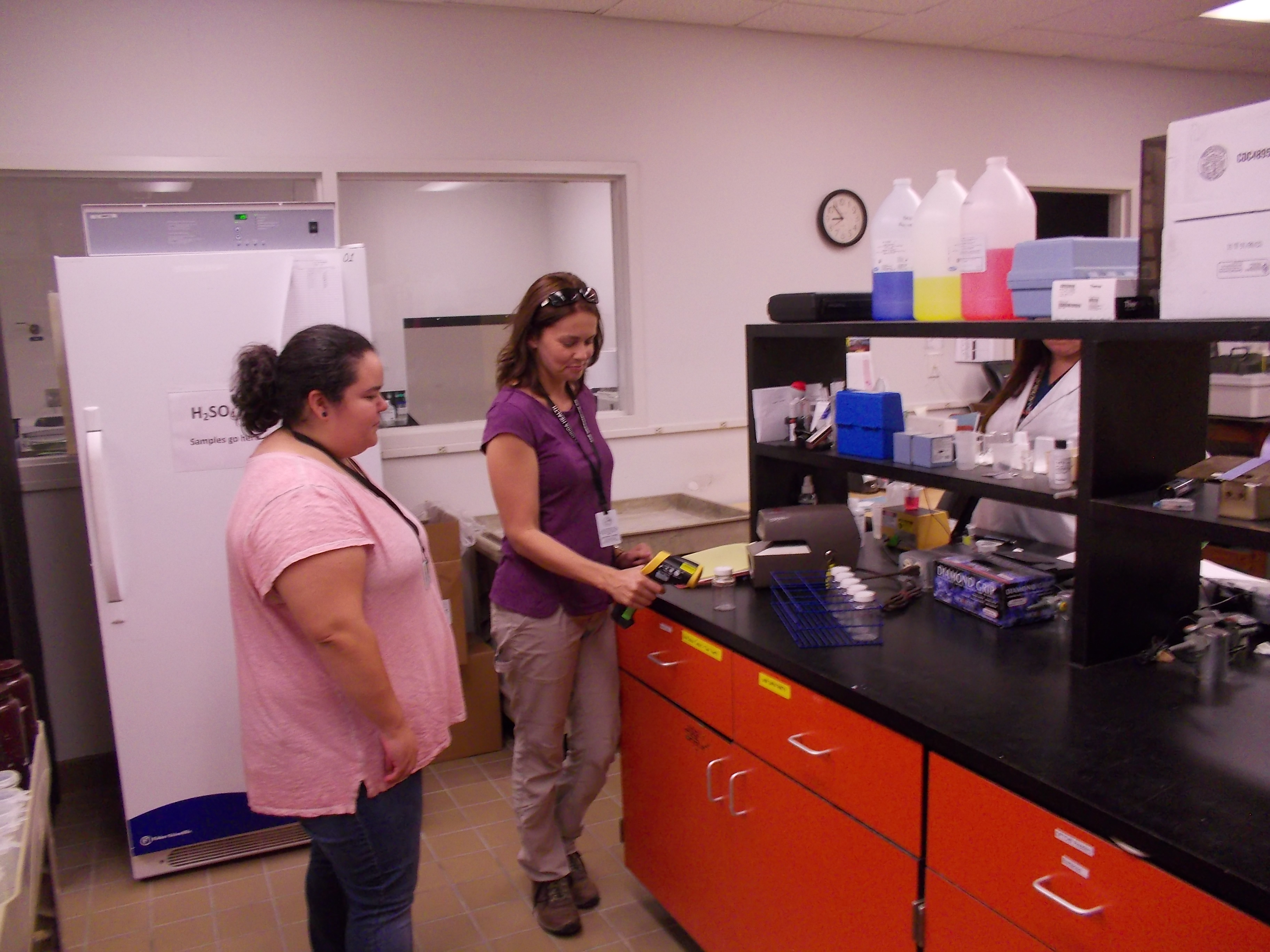 Left to Right – Andrea Garcia and Stacy Nichols checking the temperature of a water sample