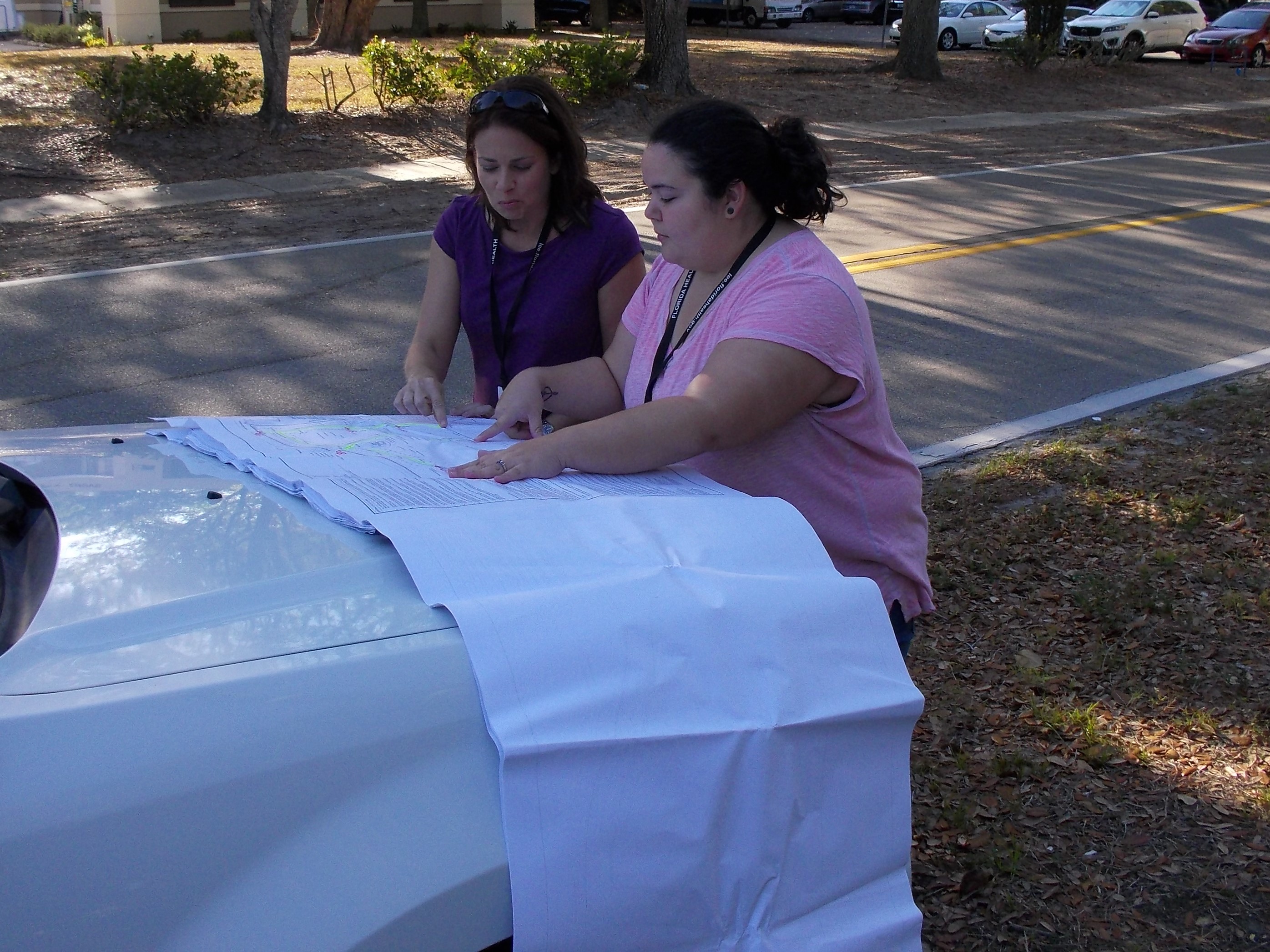Left to Right – Stacy Nichols and Andrea Garcia reviewing blueprints