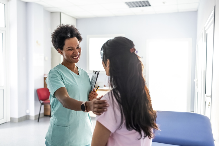 Health care worker with patient